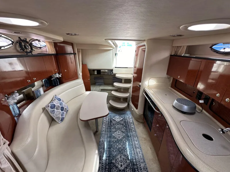 Slide: The Image of Luxurious 2003 Sea Ray 320 Sundancer cabin with elegant seating and modern amenities. - 42