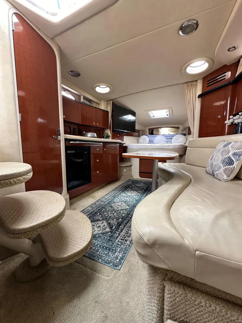 Slide: The Image of Interior of 2003 Sea Ray 320 Sundancer yacht with cozy seating and modern amenities. - 48