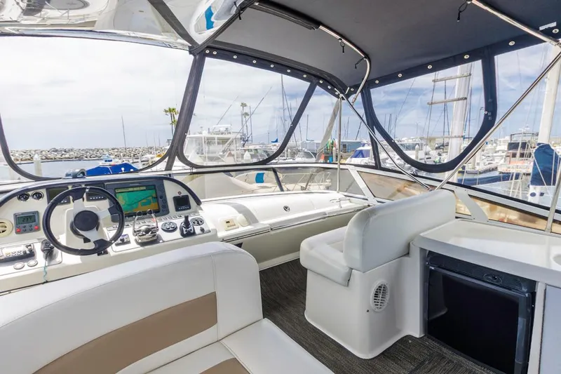 Slide: The Image of Interior view of 2007 Carver 42 Super Sport yacht with helm and seating area. - 11