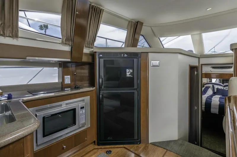 Slide: The Image of Interior of 2007 Carver 42 Super Sport yacht with kitchen and sleeping area. - 17