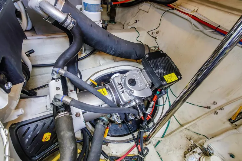 Slide: The Image of Engine compartment of a 2007 Carver 42 Super Sport boat, showcasing mechanical components and wiring. - 35