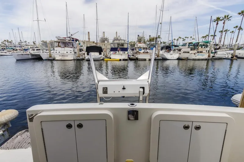 Slide: The Image of 2007 Carver 42 Super Sport yacht docked in a marina with other boats. - 6