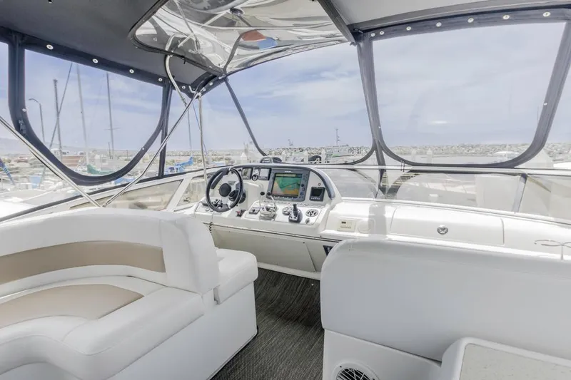 Slide: The Image of Interior of 2007 Carver 42 Super Sport yacht with modern helm and seating. - 10