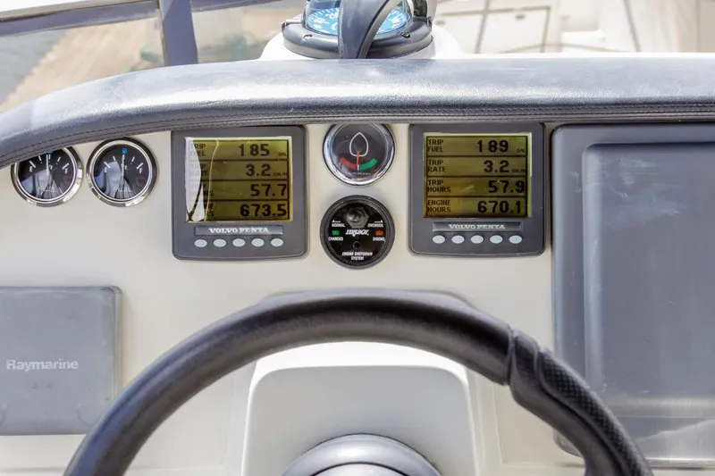 Slide: The Image of Dashboard of 2007 Carver 42 Super Sport with navigation instruments and steering wheel. - 13
