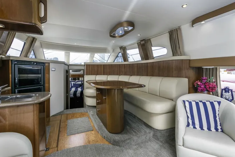 Slide: The Image of Luxurious interior of a 2007 Carver 42 Super Sport yacht with elegant seating and modern design. - 15