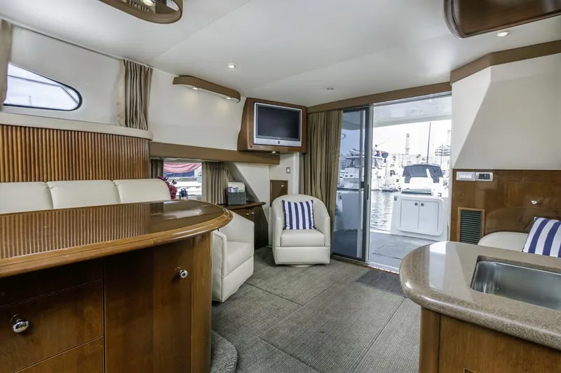Slide: The Image of Luxurious interior of 2007 Carver 42 Super Sport yacht with modern amenities and marina view. - 28