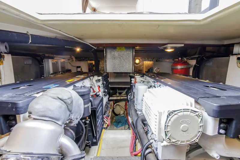 Slide: The Image of Engine room of 2007 Carver 42 Super Sport yacht, showcasing mechanical components and equipment. - 32