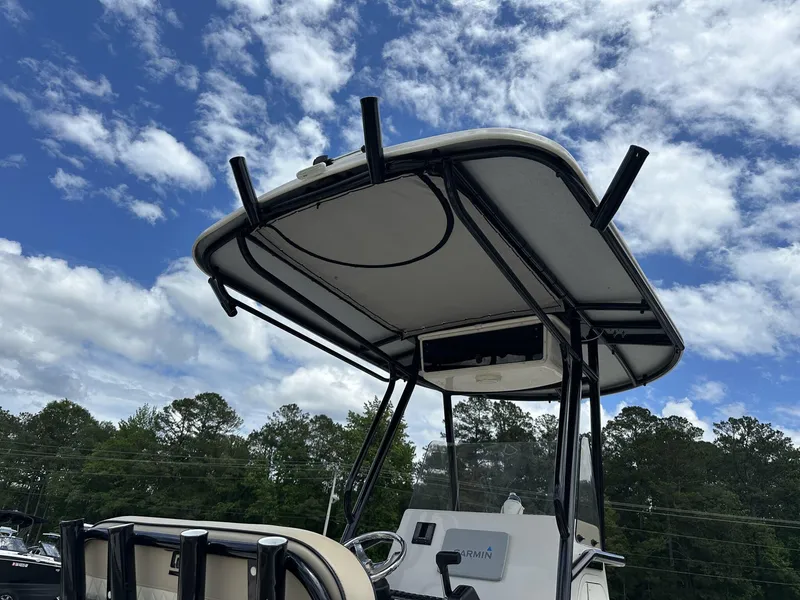 Slide: The Image of 2023 Carolina Skiff 23 Ultra Elite boat with T-top under a partly cloudy sky. - 11