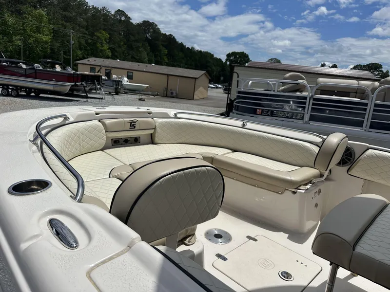 Slide: The Image of 2023 Carolina Skiff 23 Ultra Elite boat interior with beige quilted seating. - 6