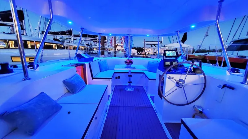 Slide: The Image of Luxurious 2025 Smart Cat S280 yacht interior with blue LED lighting at a marina. - 37