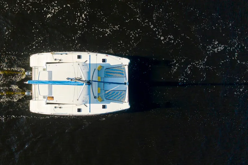 Slide: The Image of Aerial view of 2025 Smart Cat S280 catamaran sailing on dark water. - 10
