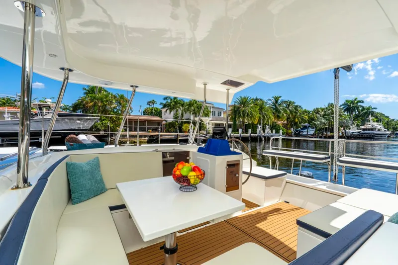 Slide: The Image of Luxurious 2025 Smart Cat S280 yacht interior with seating, table, and waterfront view. - 19