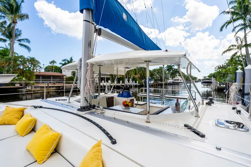 Slide: The Image of Luxury Smart Cat S280 yacht with yellow cushions, docked in a tropical marina, 2025 model. - 22