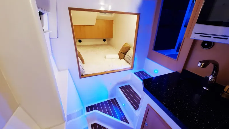 Slide: The Image of Modern Smart Cat S280 yacht interior with cozy cabin and ambient lighting, 2025 model. - 39