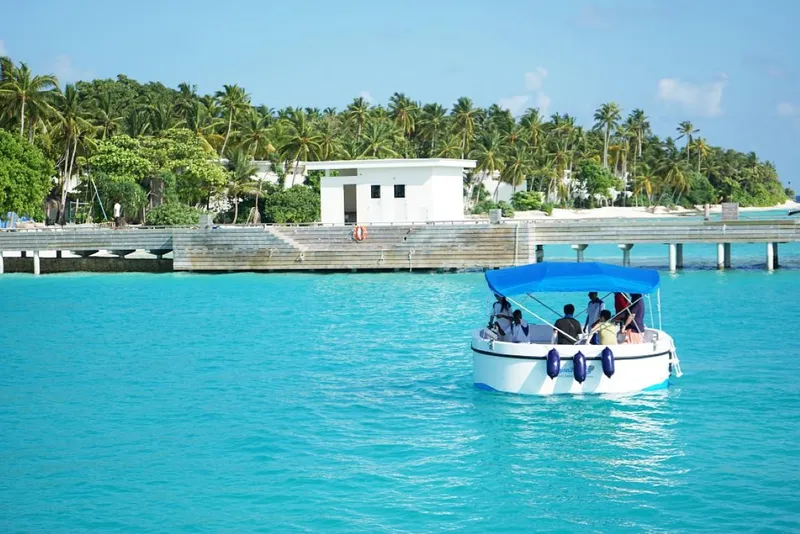 Slide: The Image of Electric semi-submarine cruising in turquoise waters near a tropical island dock, 2023. - 13
