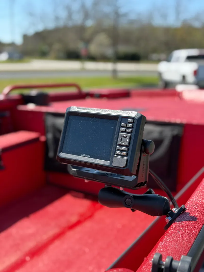 Slide: The Image of Red Excel 1751 V4 boat with Garmin device, 2024 model, parked outdoors. - 15