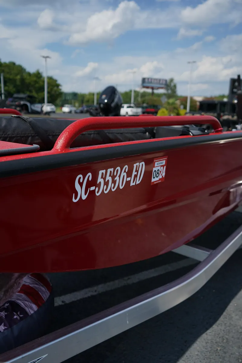 Slide: The Image of Red Excel 1751 V4 boat, 2024 model, with registration SC-5536-ED, parked outdoors. - 17