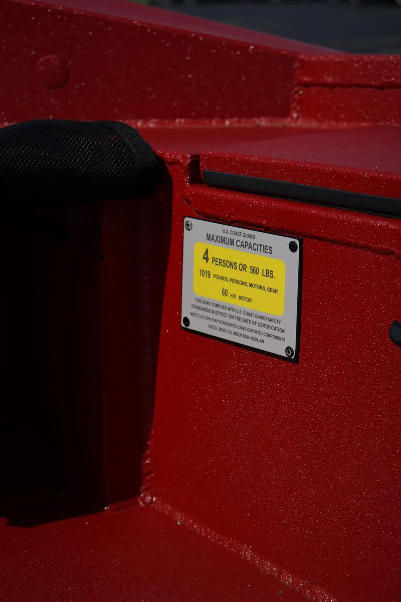 Slide: The Image of 2024 Excel 1751 V4 boat capacity label, red interior, 4-person limit, 560 lbs maximum. - 7