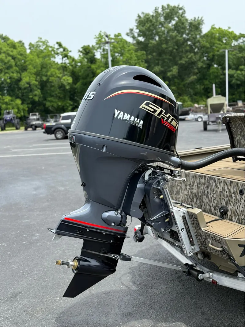 Slide: The Image of 2025 Thor Lake Hammer 1900CC boat with Yamaha outboard motor in parking lot. - 13