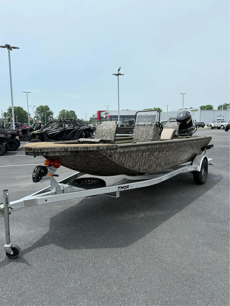 Slide: The Image of 2025 Thor Lake Hammer 1900CC boat on trailer in parking lot. - 9