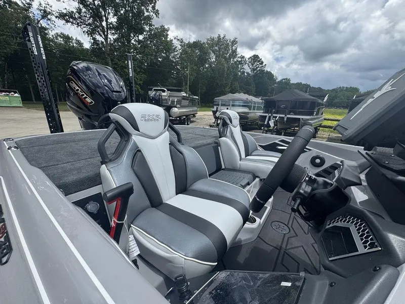 Slide: The Image of 2025 Skeeter FXR20L boat interior with sleek seats and advanced controls. - 5