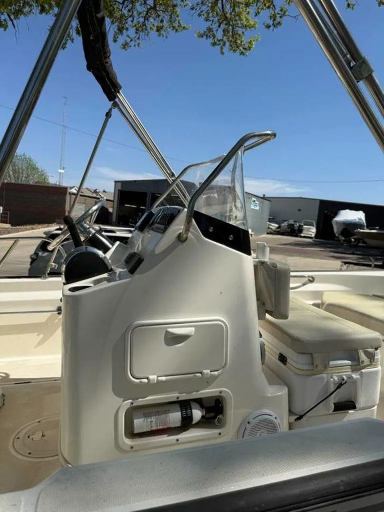 Slide: The Image of 2020 Boston Whaler 170 Montauk boat interior with console and seating. - 12