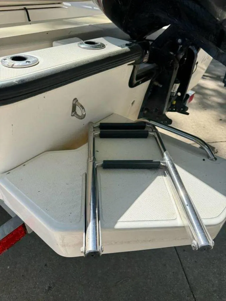 Slide: The Image of 2020 Boston Whaler 170 Montauk swim platform with foldable ladder. - 9