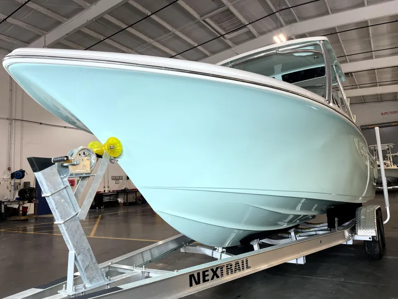 Slide: The Image of 2024 Key West 239 DFS boat on trailer in indoor facility. - 10