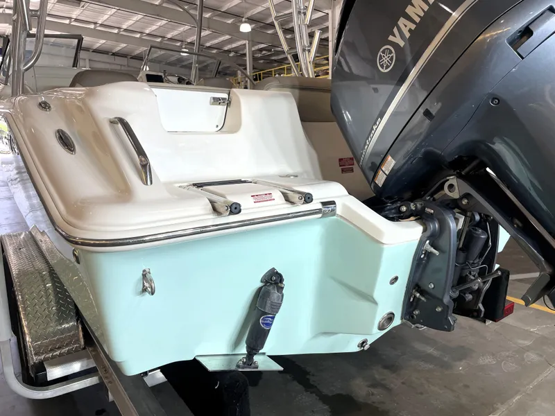 Slide: The Image of 2024 Key West 239 DFS boat with Yamaha outboard motor in a showroom. - 12