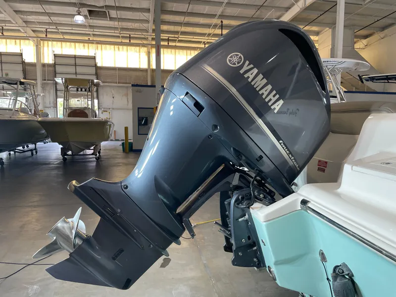 Slide: The Image of 2024 Key West 239 DFS boat with Yamaha outboard motor in a showroom. - 14