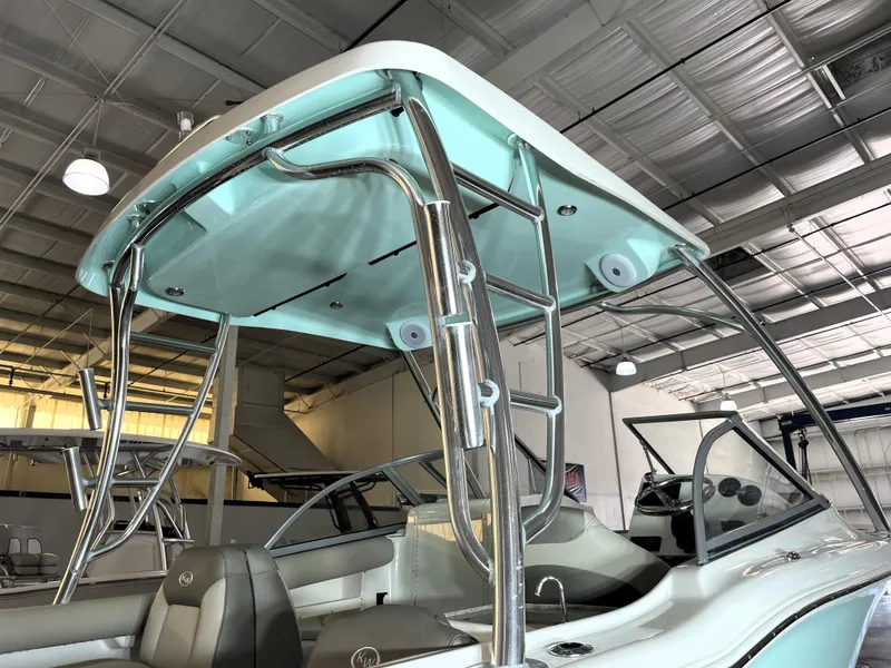 Slide: The Image of 2024 Key West 239 DFS boat interior with sleek design and modern features in a showroom. - 16
