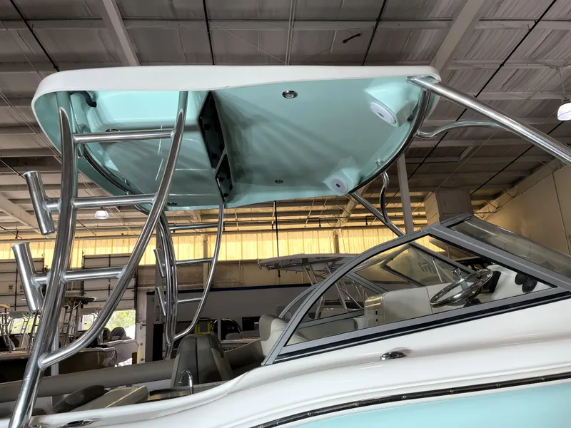 Slide: The Image of 2024 Key West 239 DFS boat with sleek design and modern features in a showroom. - 17