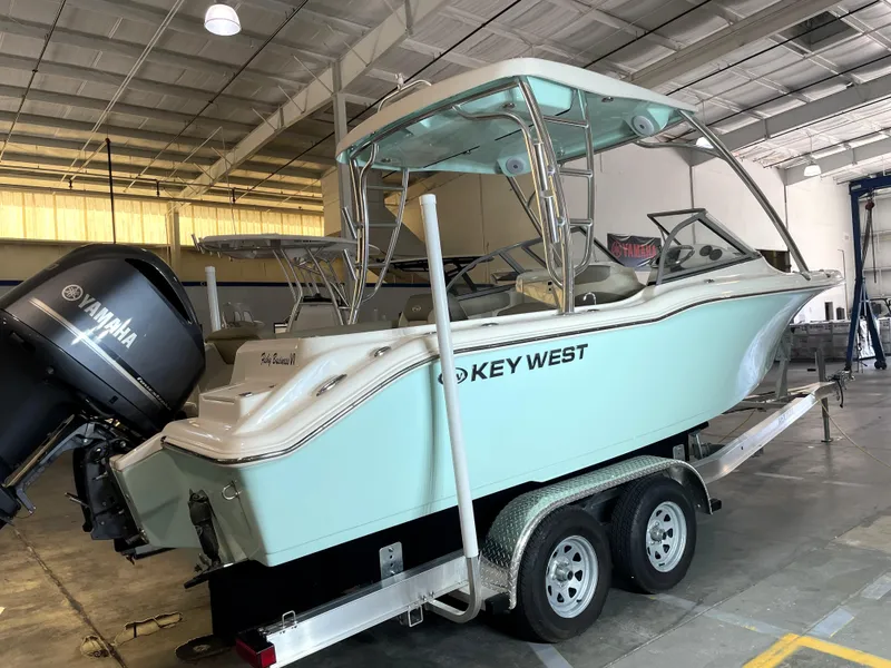 Slide: The Image of 2024 Key West 239 DFS boat on trailer in indoor storage facility. - 2