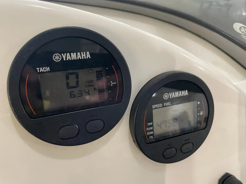 Slide: The Image of Yamaha tachometer and speed fuel gauges on 2024 Key West 239 DFS boat dashboard. - 27