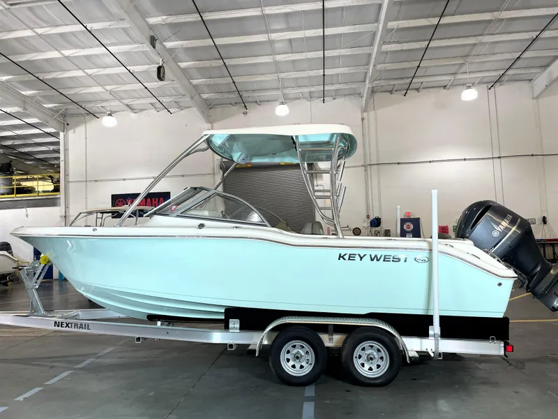 Slide: The Image of 2024 Key West 239 DFS boat on trailer in indoor showroom. - 3