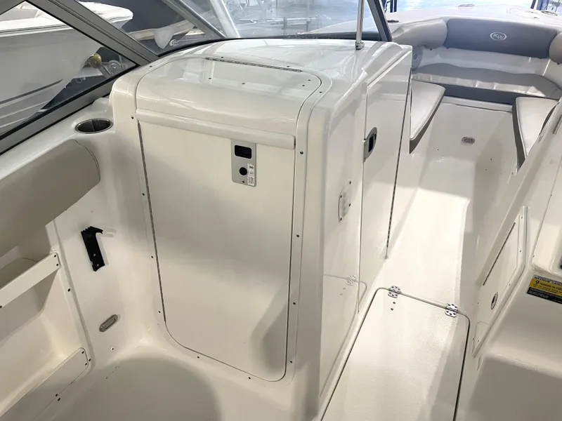 Slide: The Image of 2024 Key West 239 DFS boat interior with seating and storage compartments. - 30