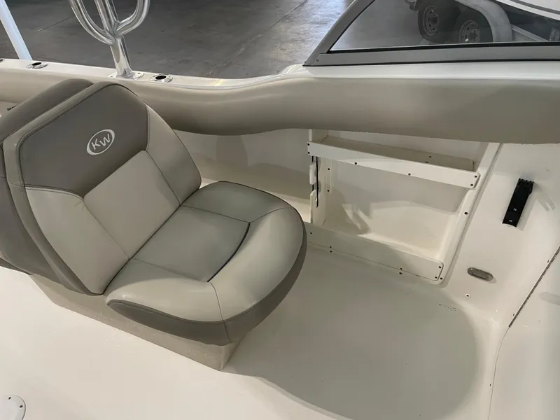 Slide: The Image of 2024 Key West 239 DFS boat interior with gray and beige seating. - 31