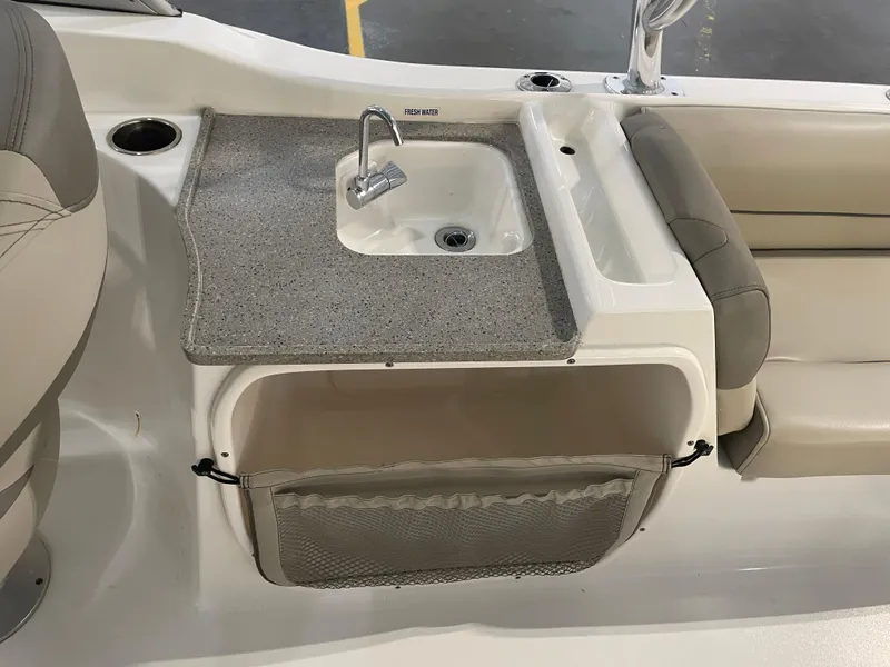 Slide: The Image of 2024 Key West 239 DFS boat interior with sink and seating area. - 33