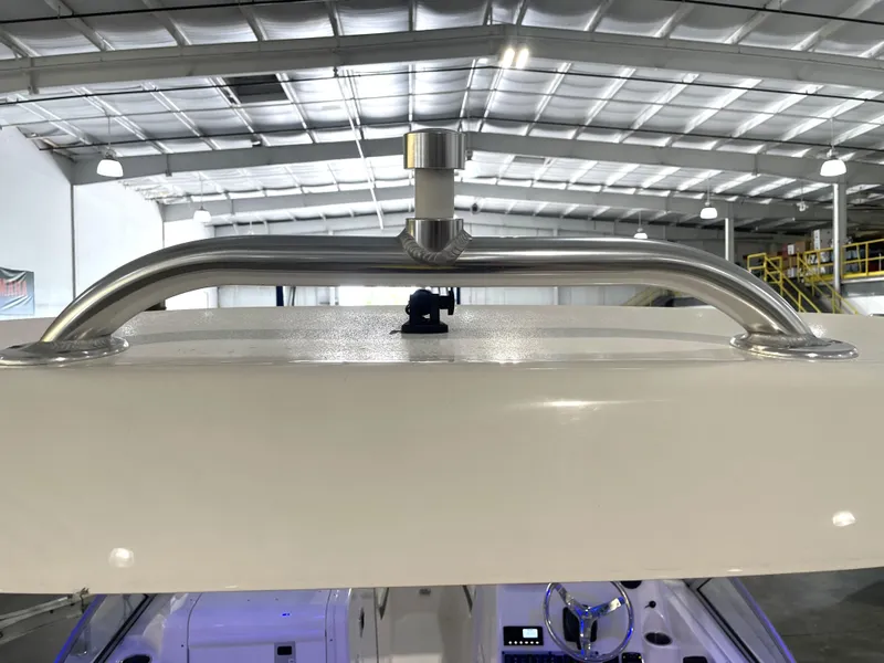 Slide: The Image of 2024 Key West 239 DFS boat interior with stainless steel grab rail in a warehouse setting. - 38