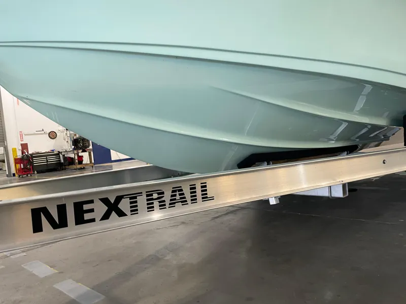 Slide: The Image of 2024 Key West 239 DFS boat on NexTrail trailer in a workshop. - 42