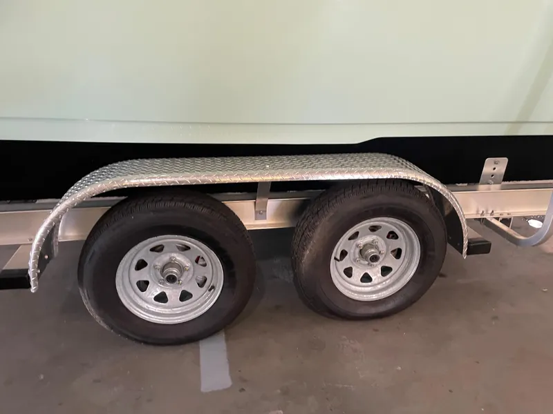 Slide: The Image of Trailer wheels and fender of 2024 Key West 239 DFS boat. - 43