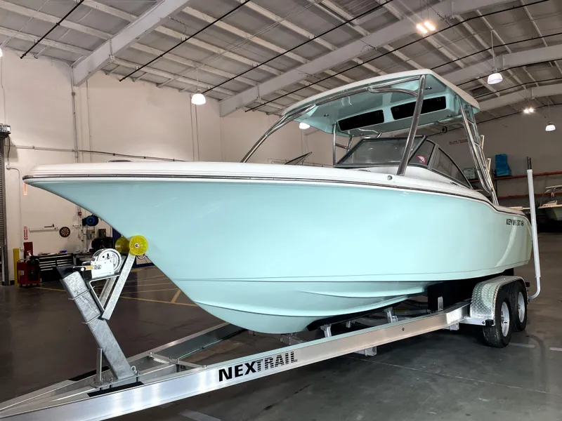 Slide: The Image of 2024 Key West 239 DFS boat on trailer in indoor storage facility. - 5