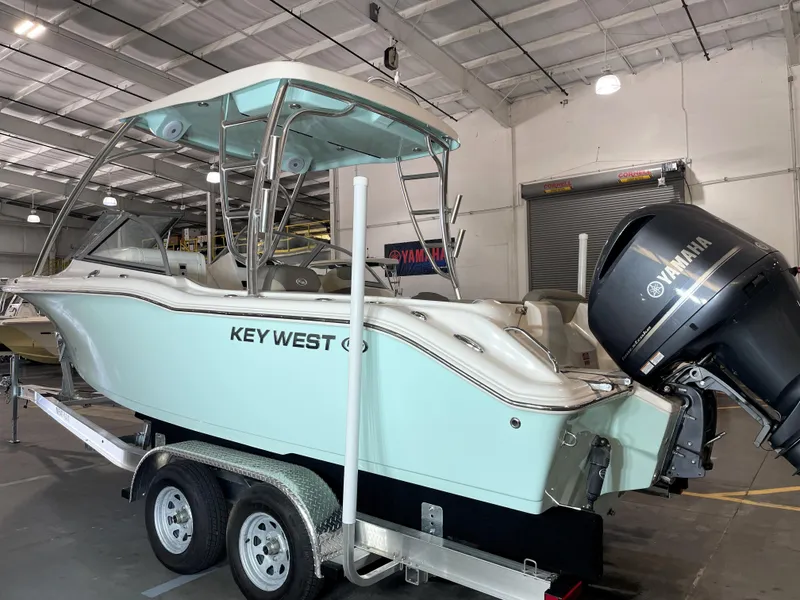 Slide: The Image of 2024 Key West 239 DFS boat with Yamaha engine in a showroom. - 6