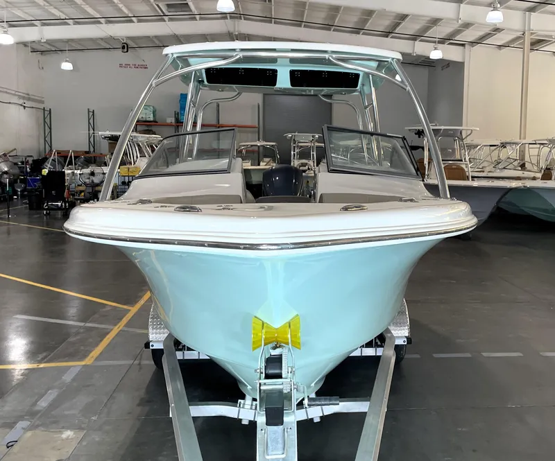 Slide: The Image of 2024 Key West 239 DFS boat in showroom, front view on trailer. - 7
