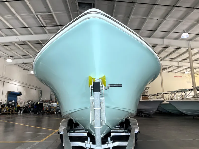 Slide: The Image of 2024 Key West 239 DFS boat in a warehouse, front view on trailer. - 8