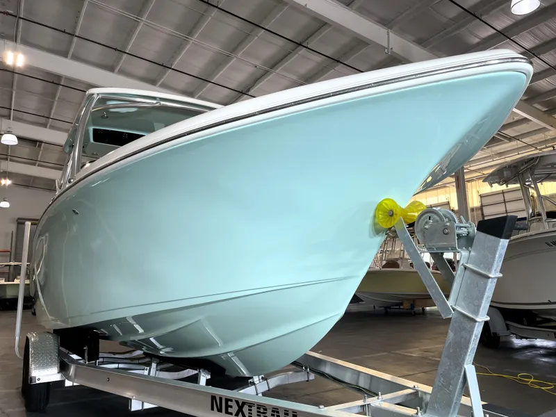 Slide: The Image of 2024 Key West 239 DFS boat on trailer in showroom. - 9