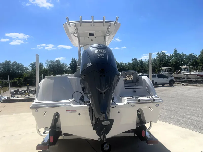 Slide: The Image of 2023 Sea Fox 228 Commander boat with powerful 250 HP engine, parked outdoors. - 12