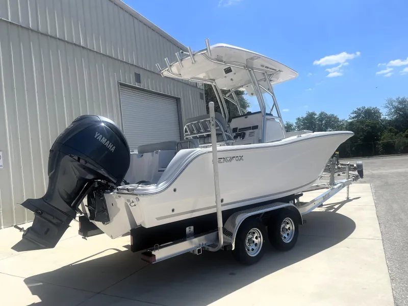 Slide: The Image of 2023 Sea Fox 228 Commander boat on trailer, parked outside a warehouse. - 6