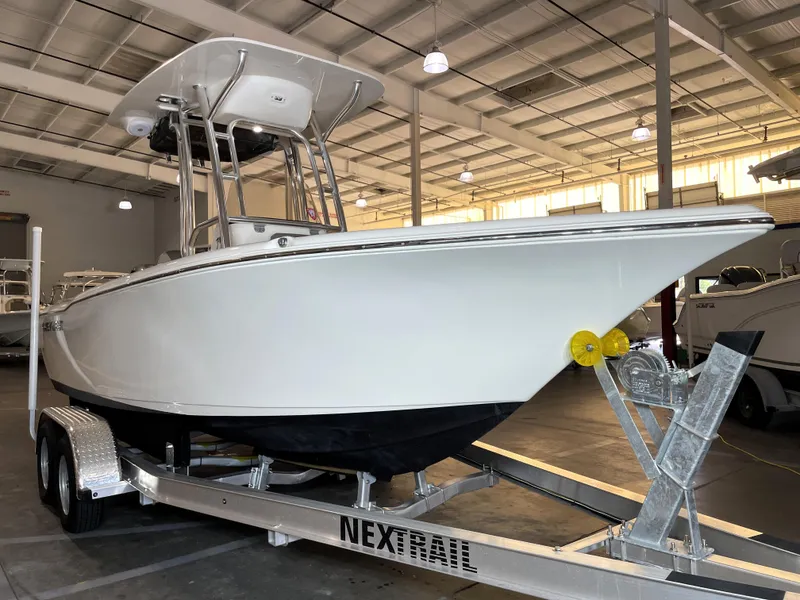 Slide: The Image of 2023 Key West 203 FS boat on trailer in indoor showroom. - 1