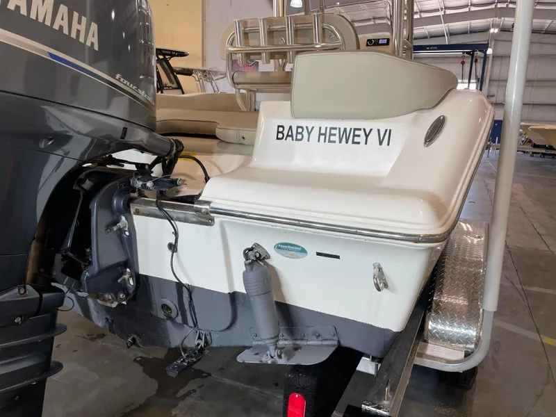 Slide: The Image of 2023 Key West 203 FS boat named "Baby Hewey VI" in a storage facility. - 12